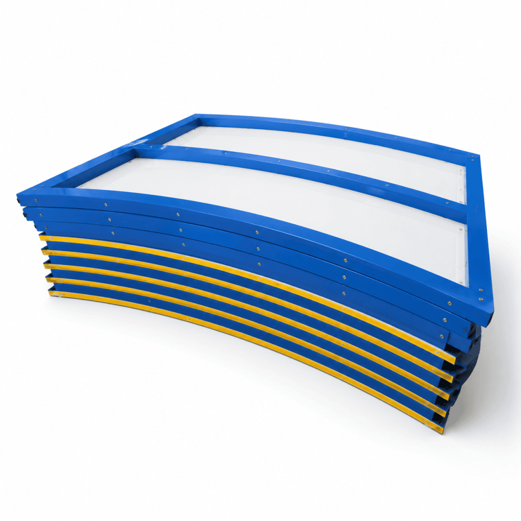Indoor synthetic ice rink system with white skating panels and blue dasher boards